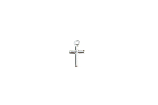 Silver cross pendant on a marble background