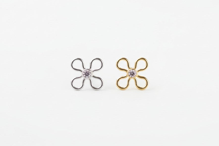 2 flowers on a white surface
