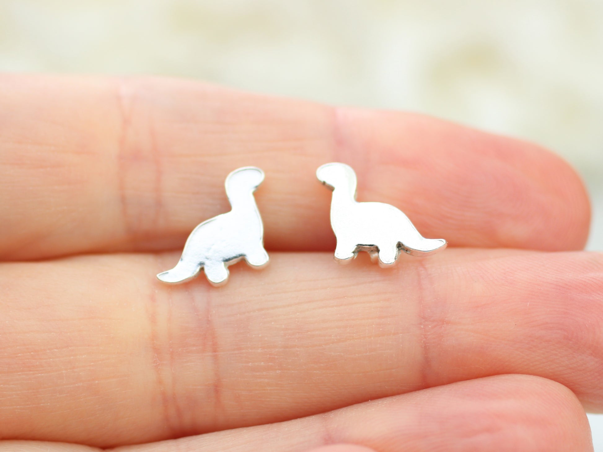 diplodocus stud earrings