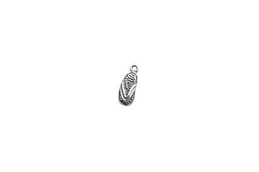 flip flop charm on a white surface