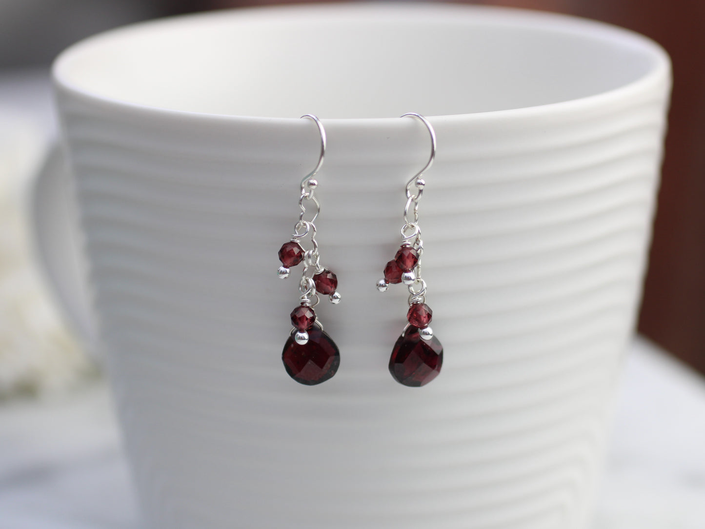 Garnet cluster earrings in sterling silver.