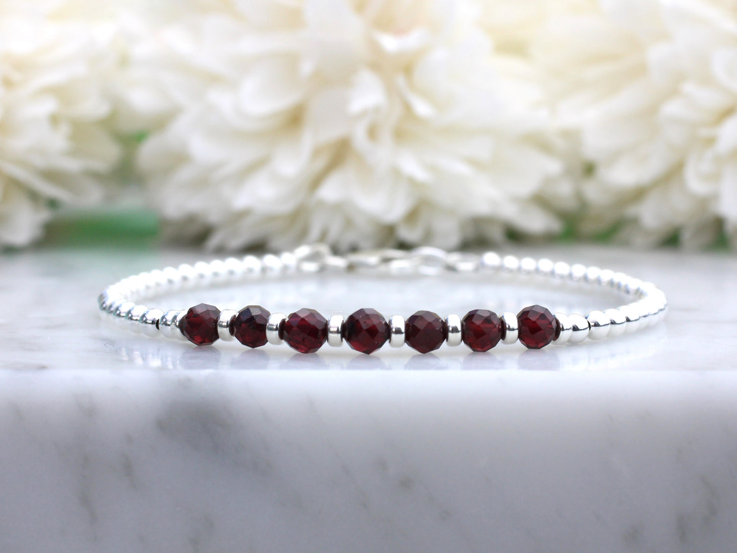 garnet gemstone and silver bracelet