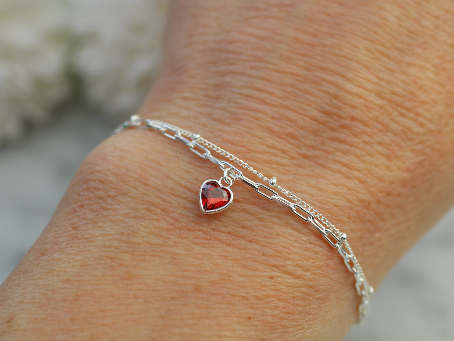 Sterling silver birth month layered bracelet with crystal heart