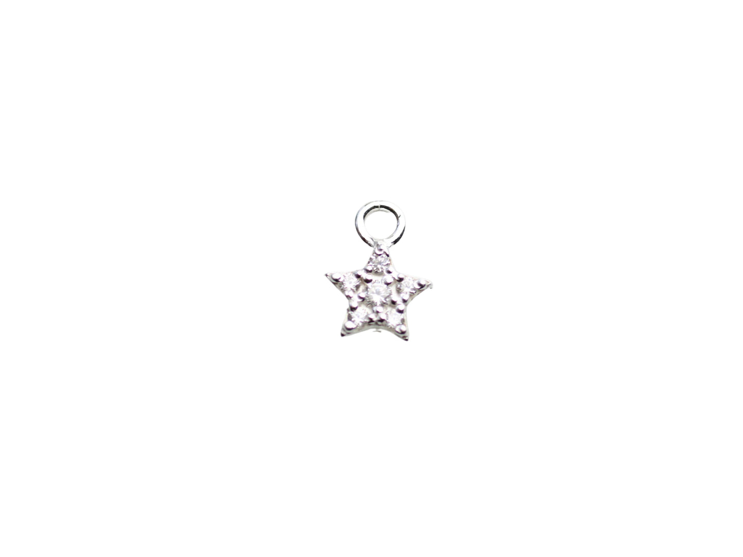Star-shaped silver pendant with clear stones on a light gray marble background