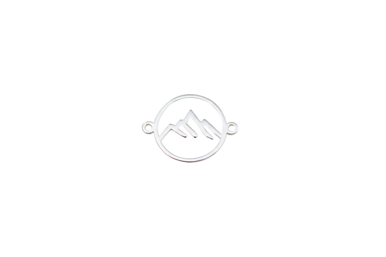 White mountain-shaped jewelry connector on a light background