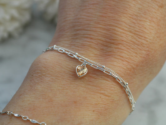 november crystal layered bracelet with a yellow heart charm