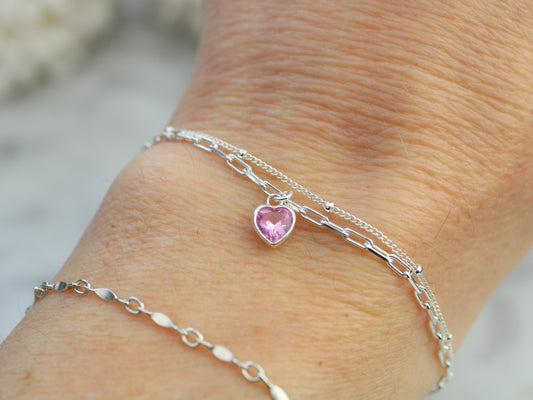 october crystal layered bracelet with a pink charm