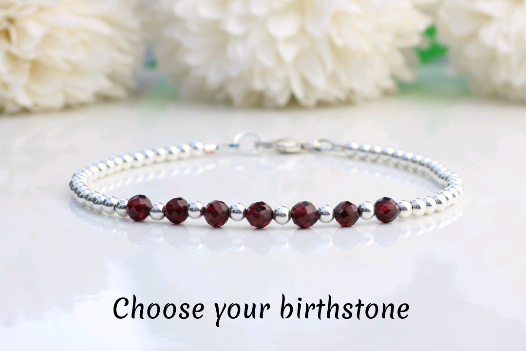 personalised milestone bracelet in sterling silver with 1 gemstone per decade