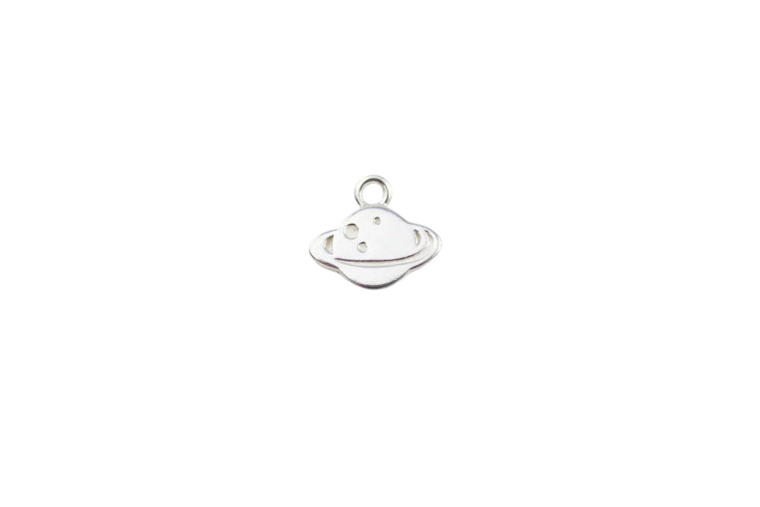 Silver planet charm on a light gray background