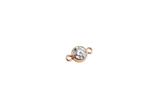 rose gold connector on a white surface