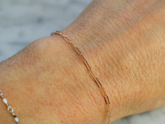 rose gold chain on a wrist