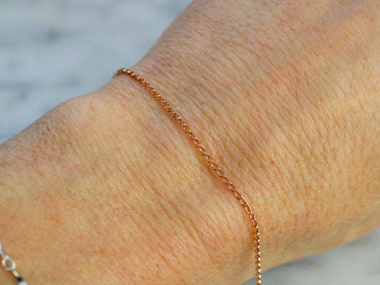 rose gold chain on a wrist