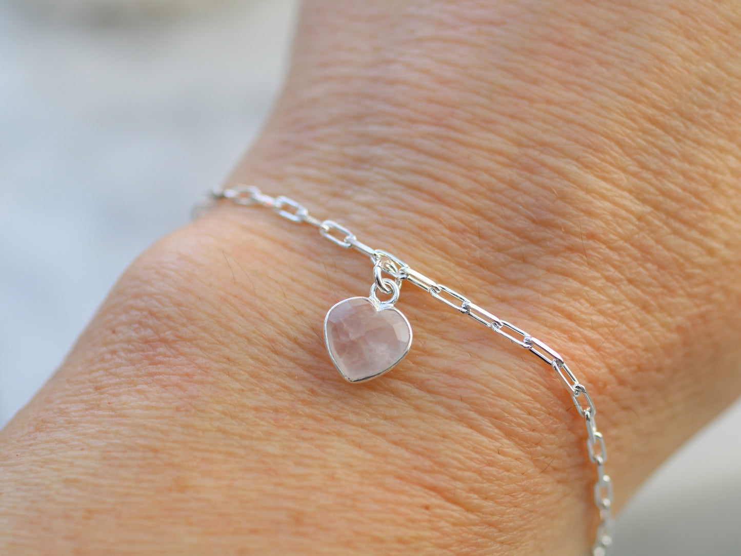 Rose quartz heart charm adjustable bracelet.