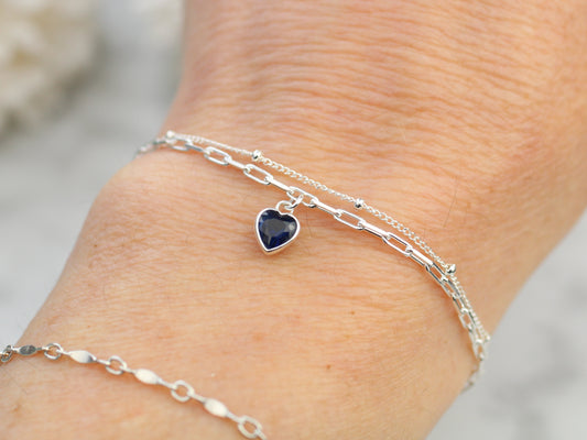 september crystal layered bracelet with a blue charm