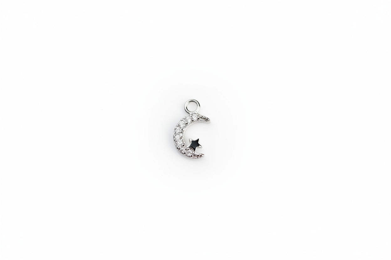 moon charm on a white surface