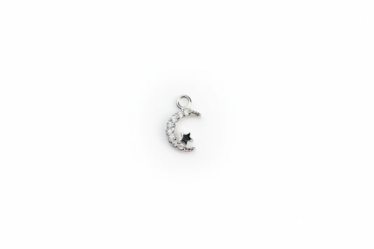 moon charm on a white surface