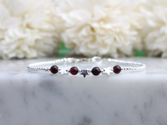 Star bracelet with natural garnet beads.