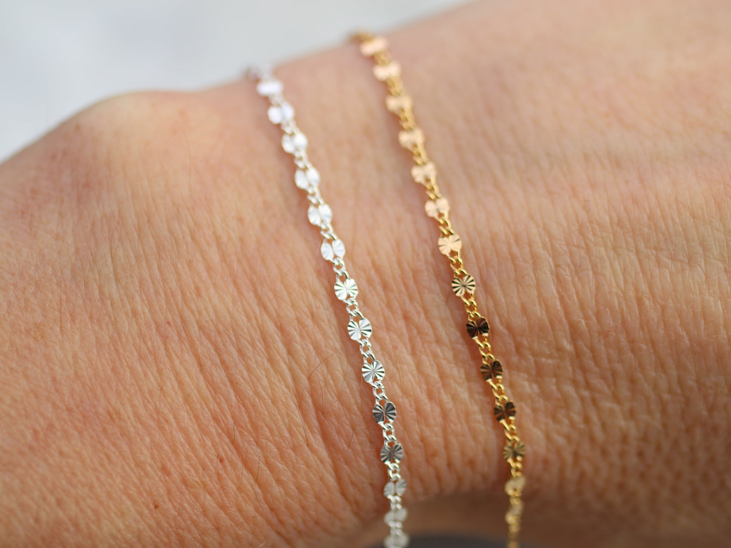 two bracelet chain on a wrist