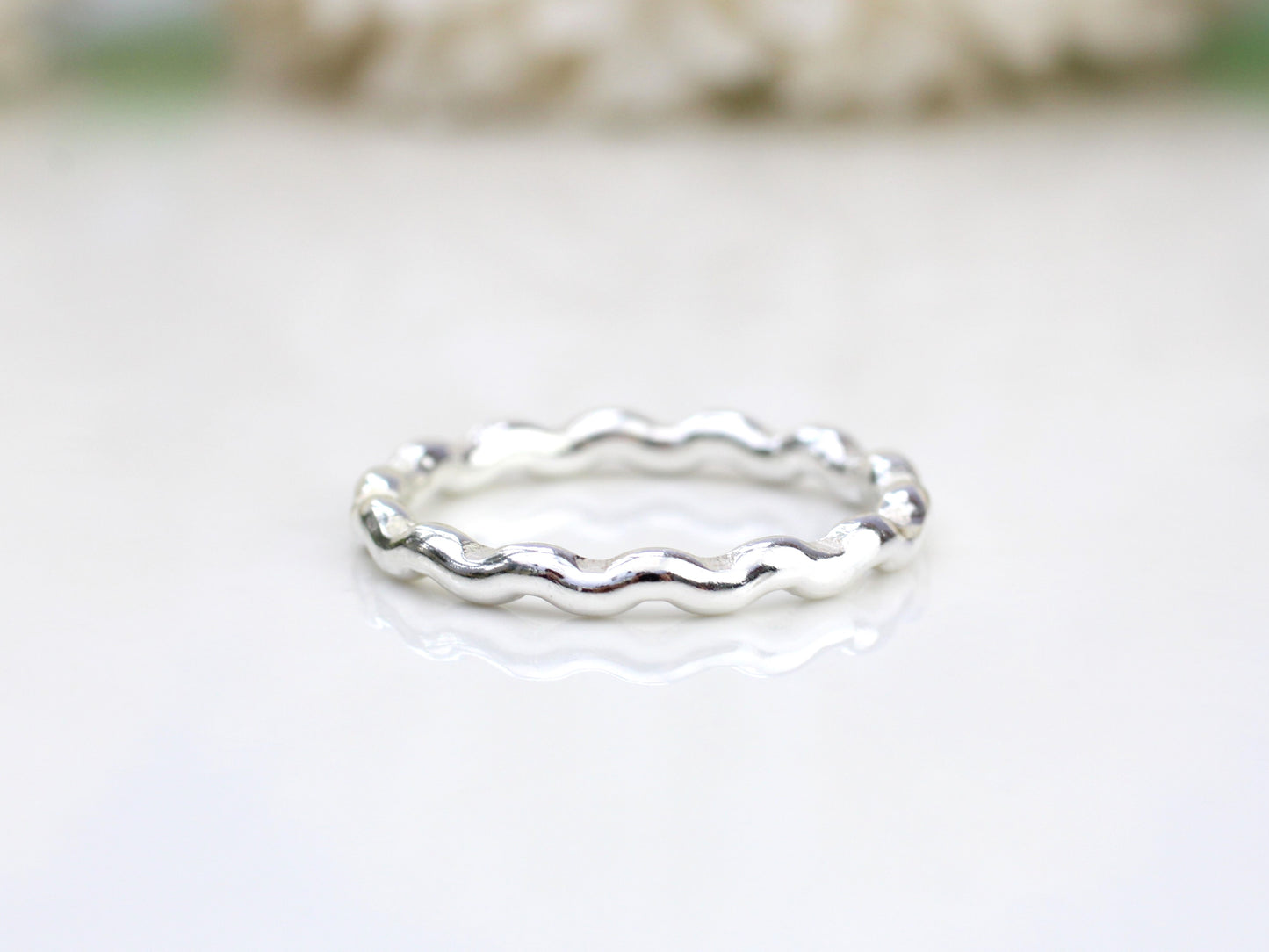 Wavy ring made from recycled sterling silver.