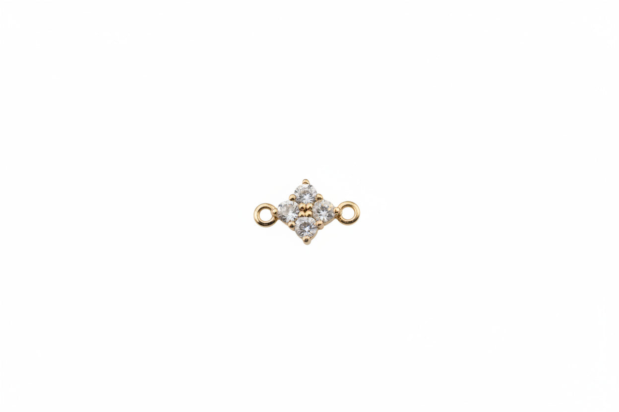 Gold and gemstone jewelry piece on a marble background