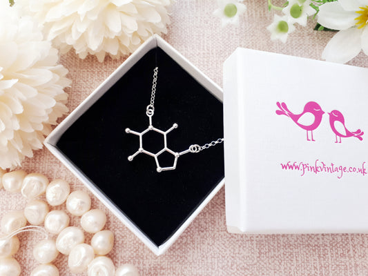 Caffeine molecule necklace.