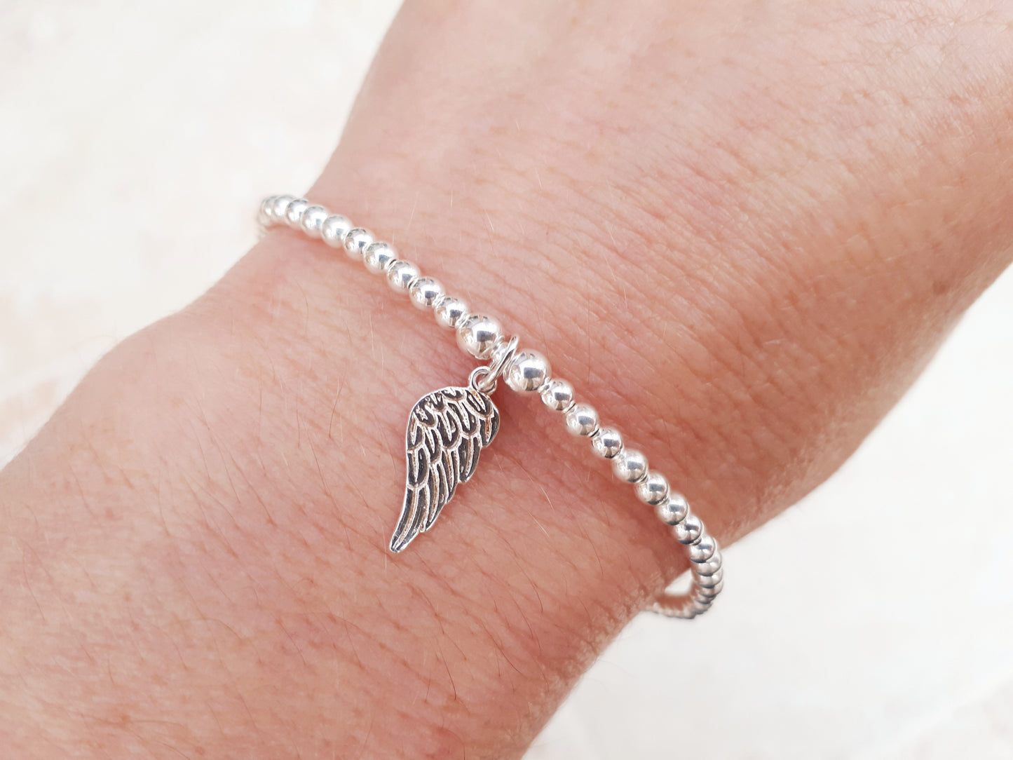 Angel wing charm bracelet.