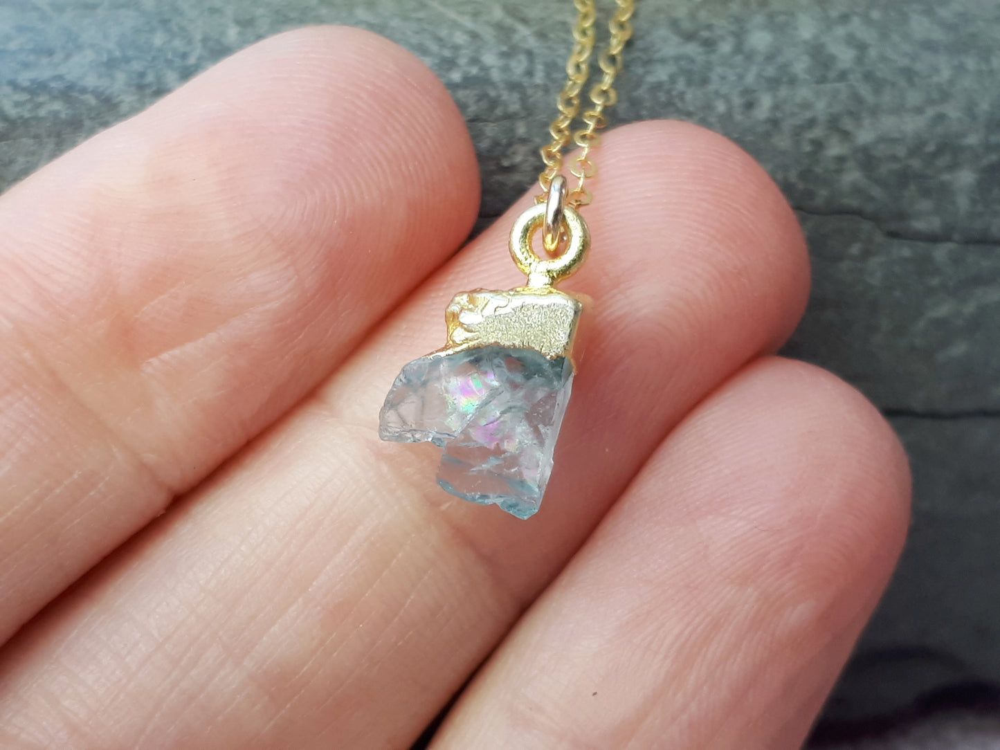 Raw aquamarine necklace in gold.