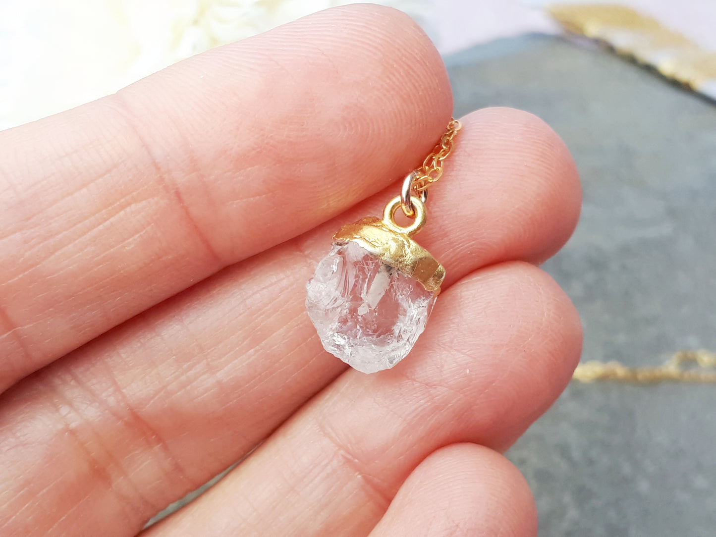 Clear quartz necklace in gold. April birthstone.