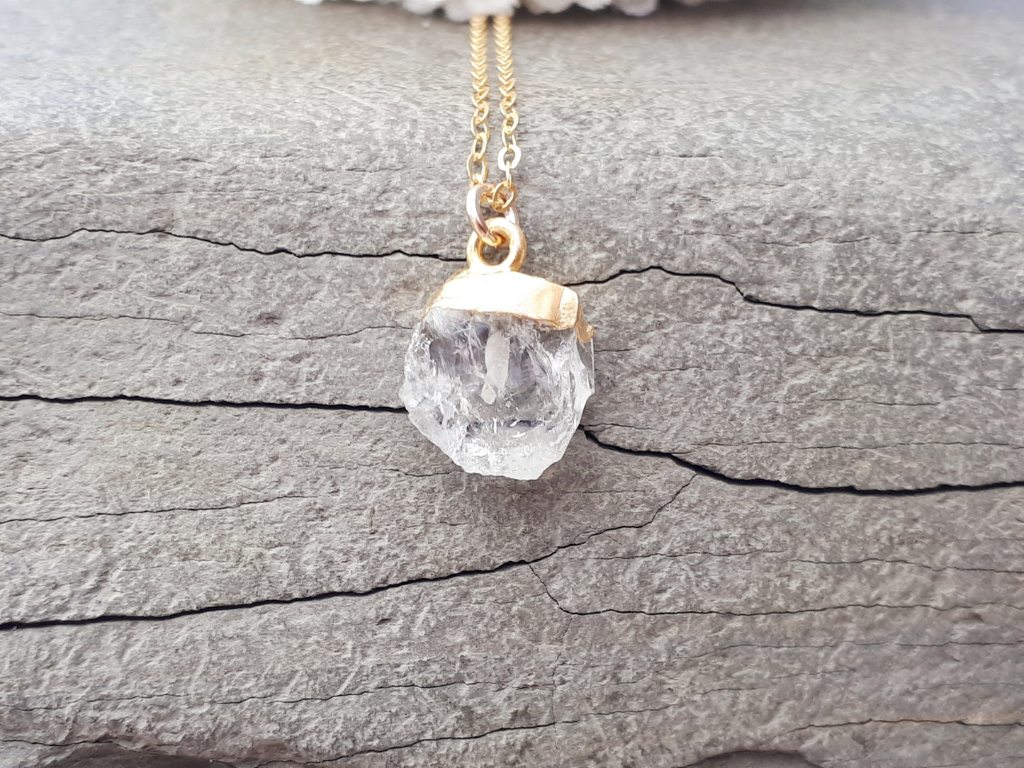 Clear quartz necklace in gold. April birthstone.
