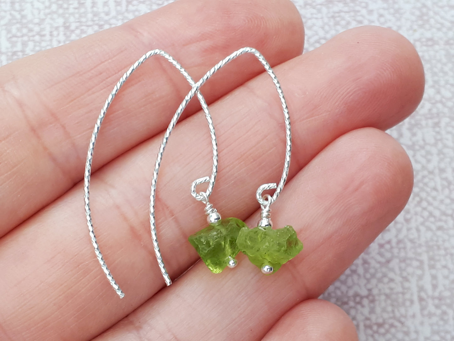 Raw peridot earrings in sterling silver.