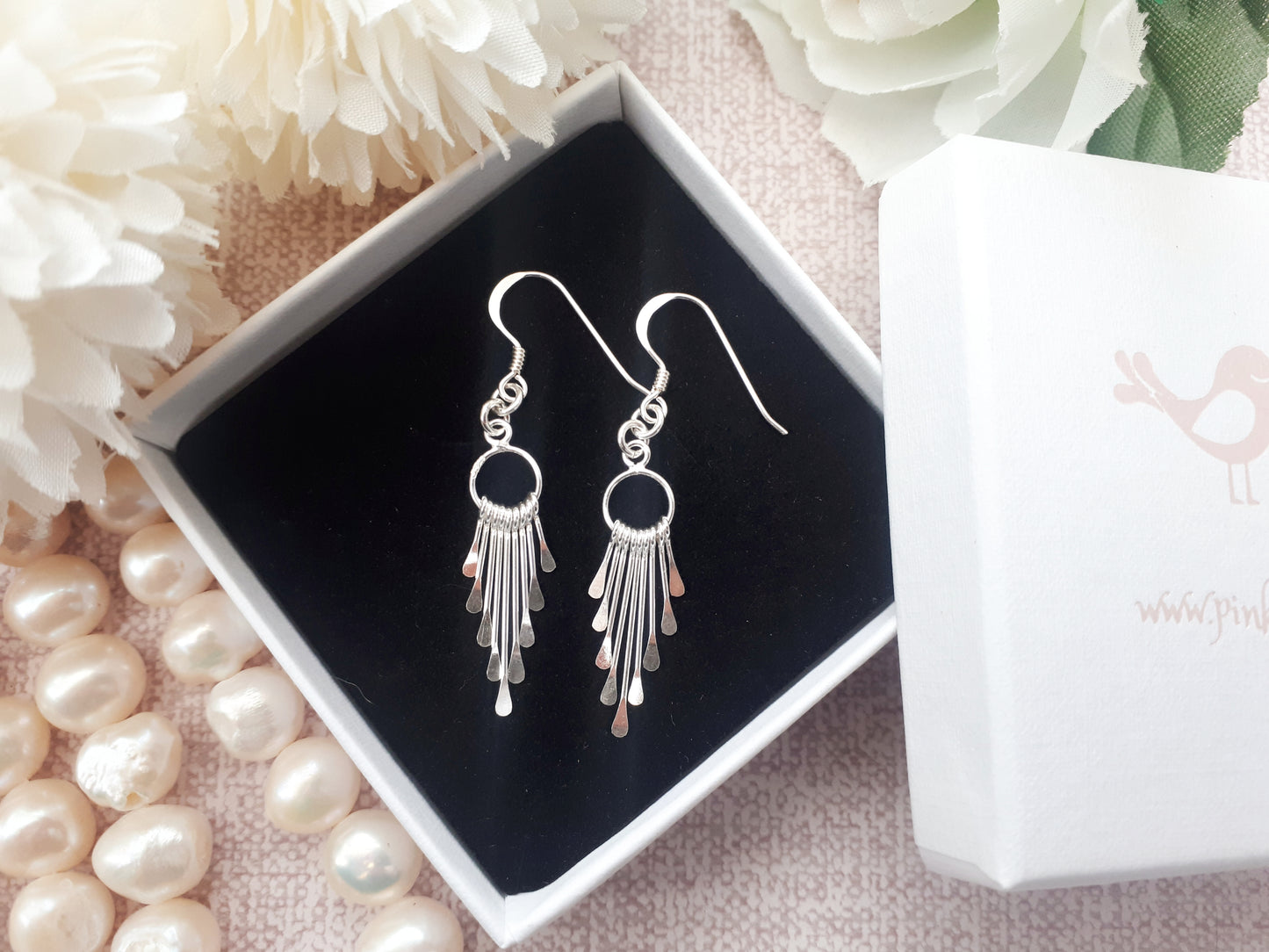 Silver tassel earrings.