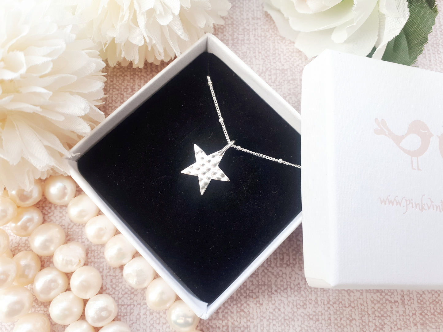Star necklace with optional birthstone.