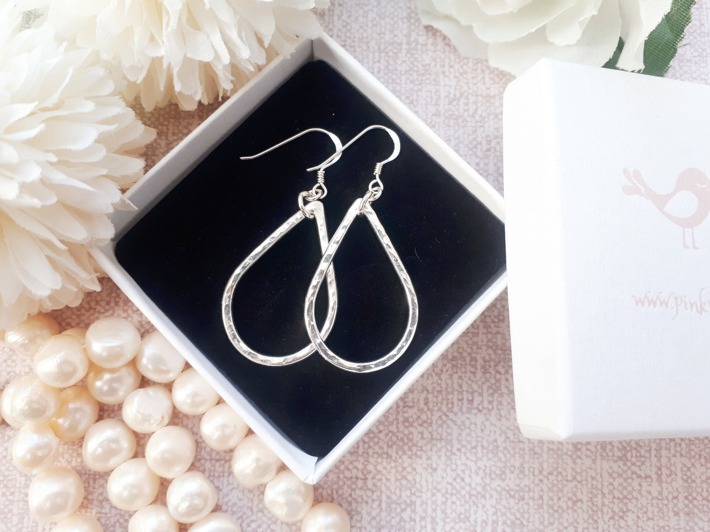 Silver teardrop earrings.