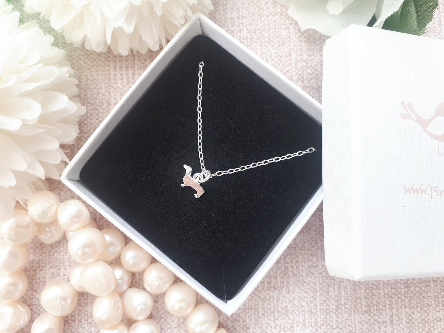 Sterling silver dachshund necklace.