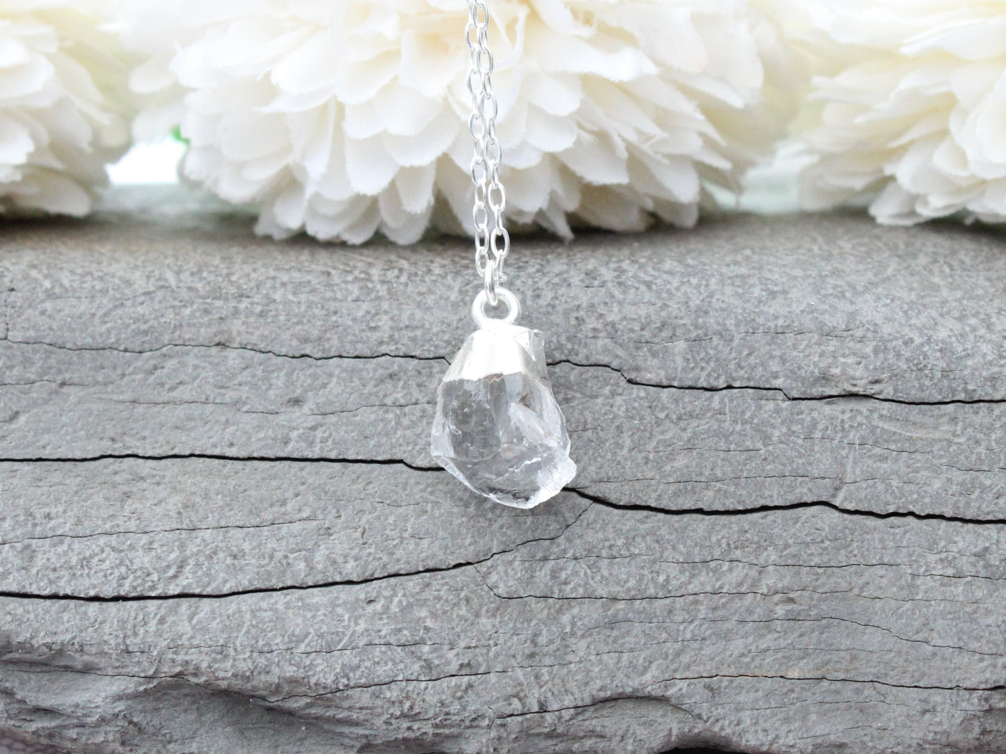 Raw crystal quartz necklace in sterling silver.