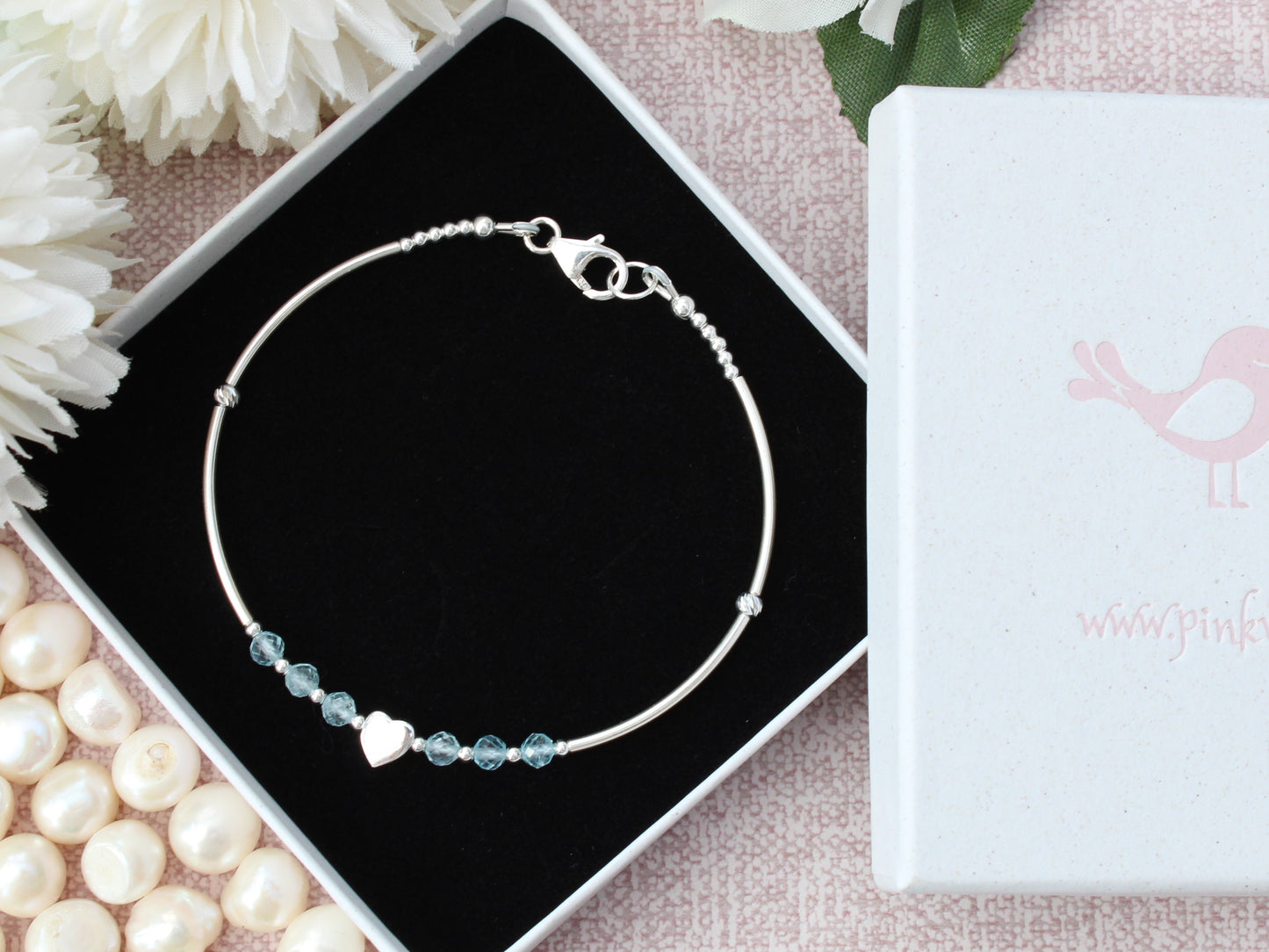 Personalised topaz bracelet in sterling silver.