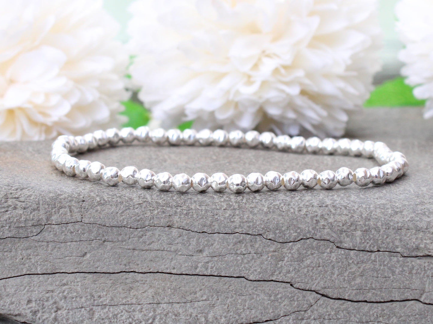 Sterling silver hammered bead bracelet.