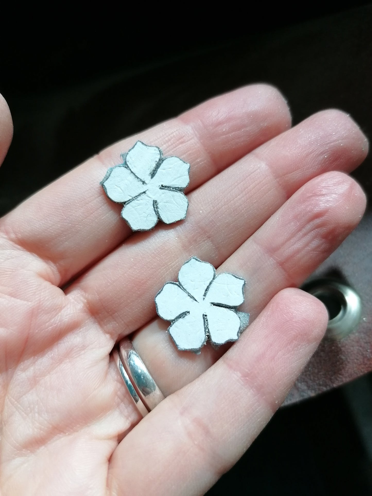 Flower drop earrings in sterling silver.