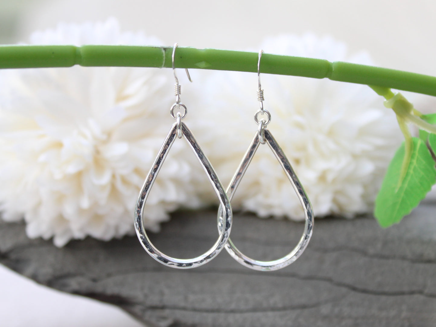 Silver teardrop earrings.