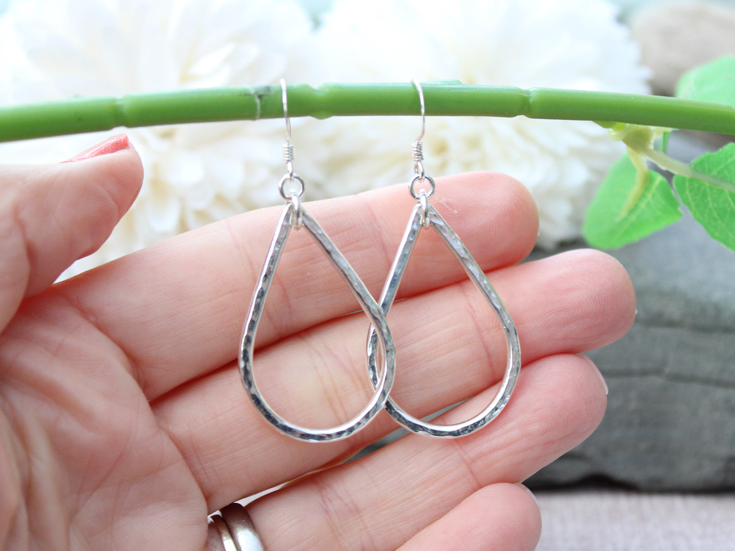 Silver teardrop earrings.