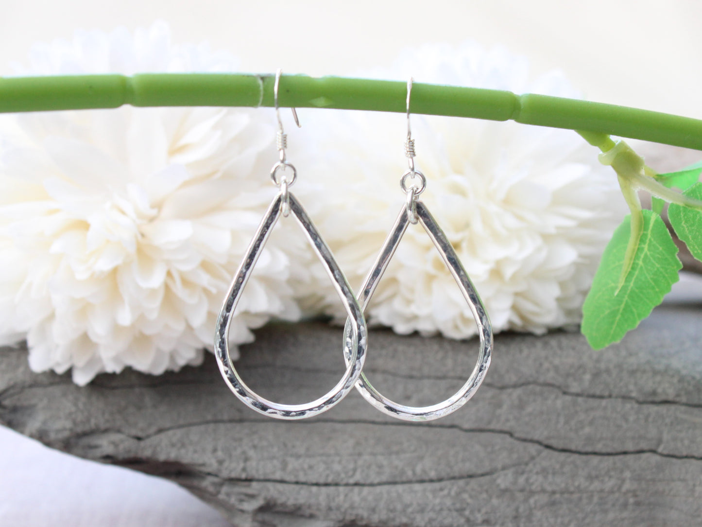 Silver teardrop earrings.